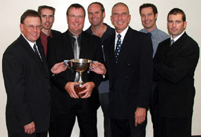 The first reserve grade men with their competition trophy