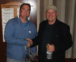 Stephen Cunis receives his award from Ric Charlesworth